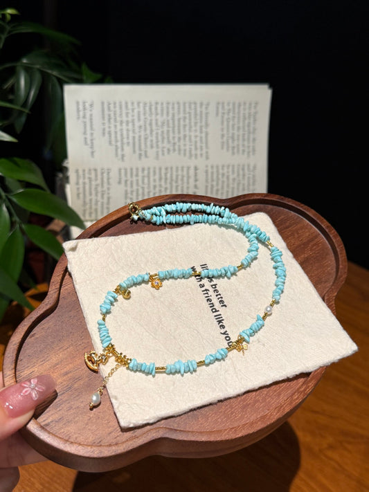 Natural Turquoise Heishi Beaded Necklace with Gold Rocking Horse Charm — A Wish for Pure Joy and Smooth Journeys