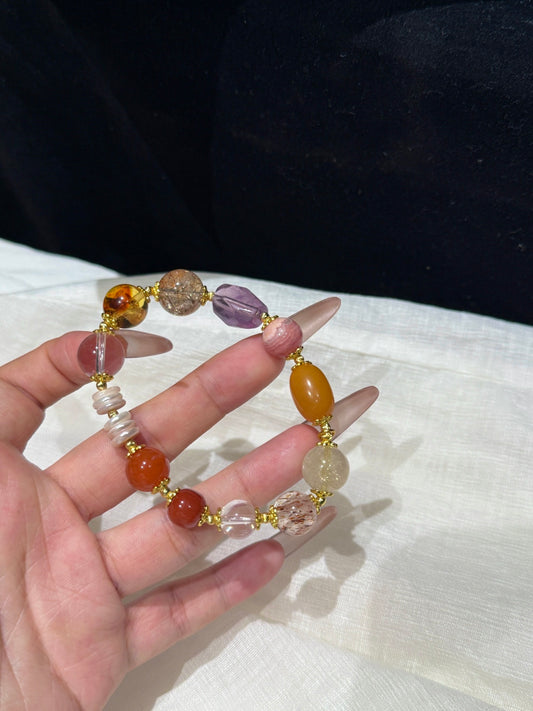 Multi-Gemstone Bracelet with Black Gold Super Seven, Vintage Amber &amp; Rhodochrosite — A Wish for Peace and Radiant Fortune
